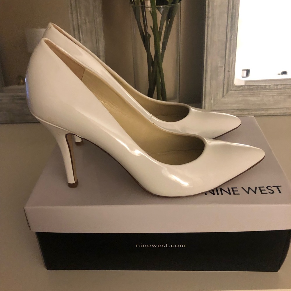 Nine West White patent pumps.  Like new.